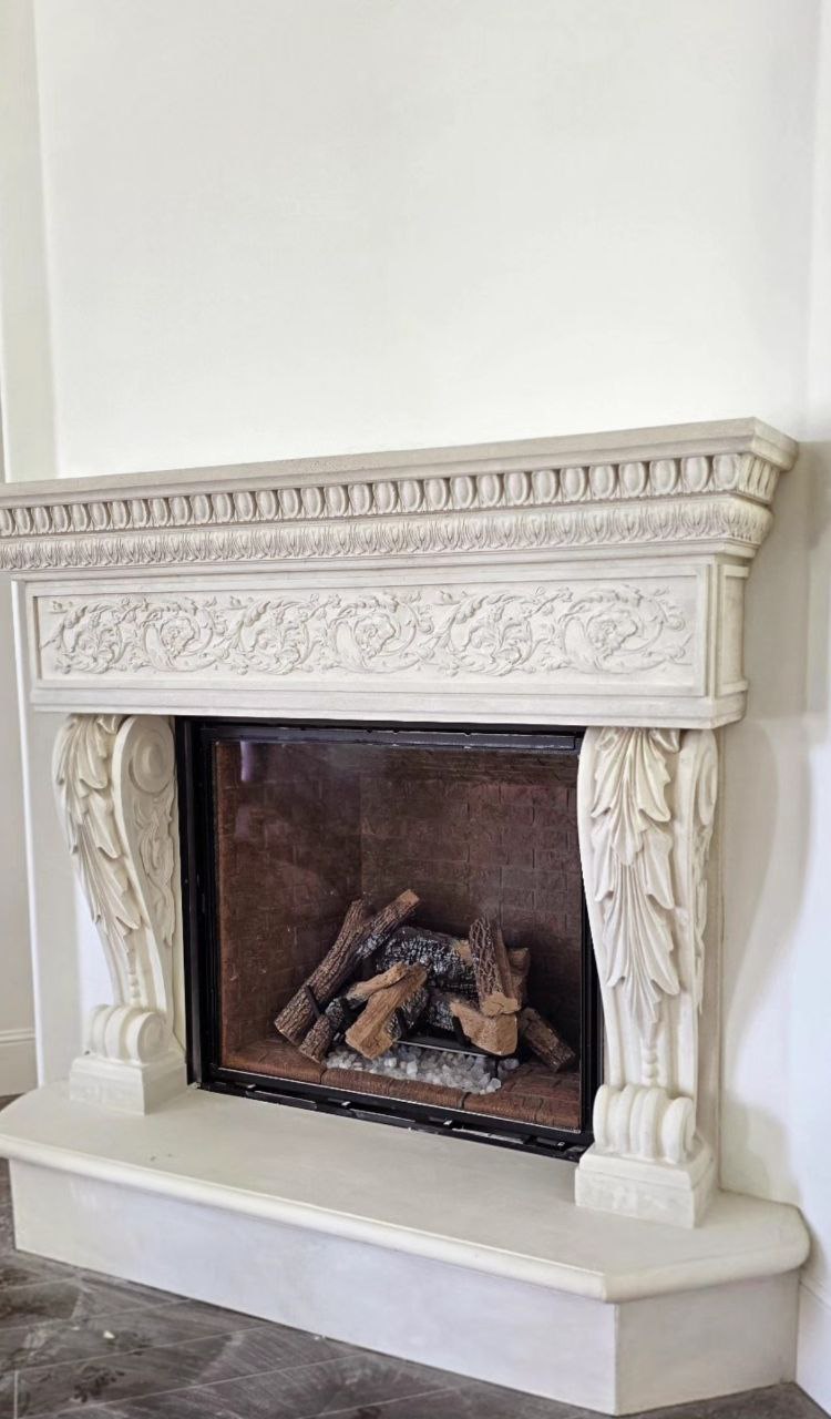 Custom ornate precast concrete fireplace mantel with classical carved details manufactured by Lions Precast