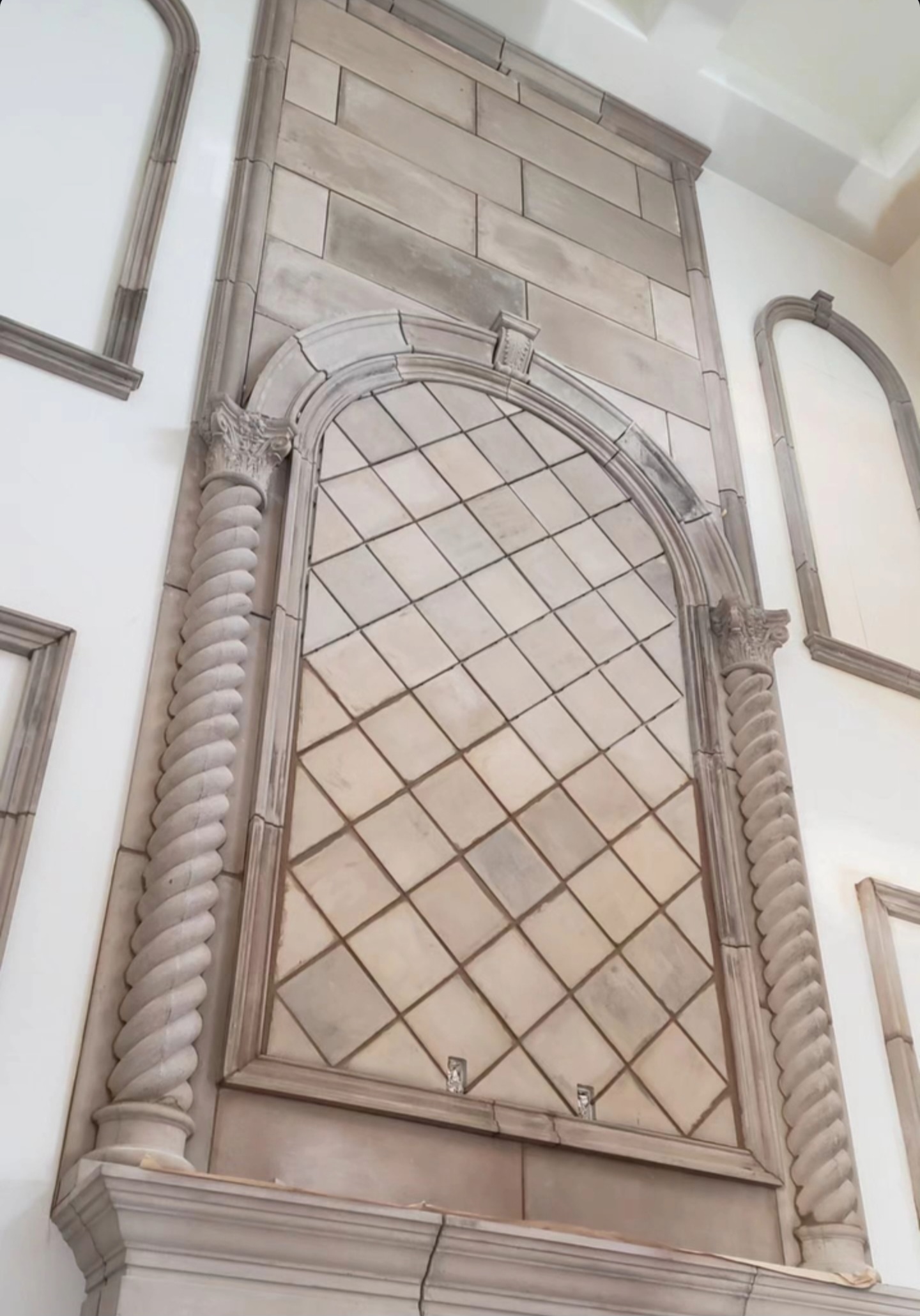 Custom architectural precast wall niche with twisted columns and decorative arch installed by Lions Precast in Fresno California