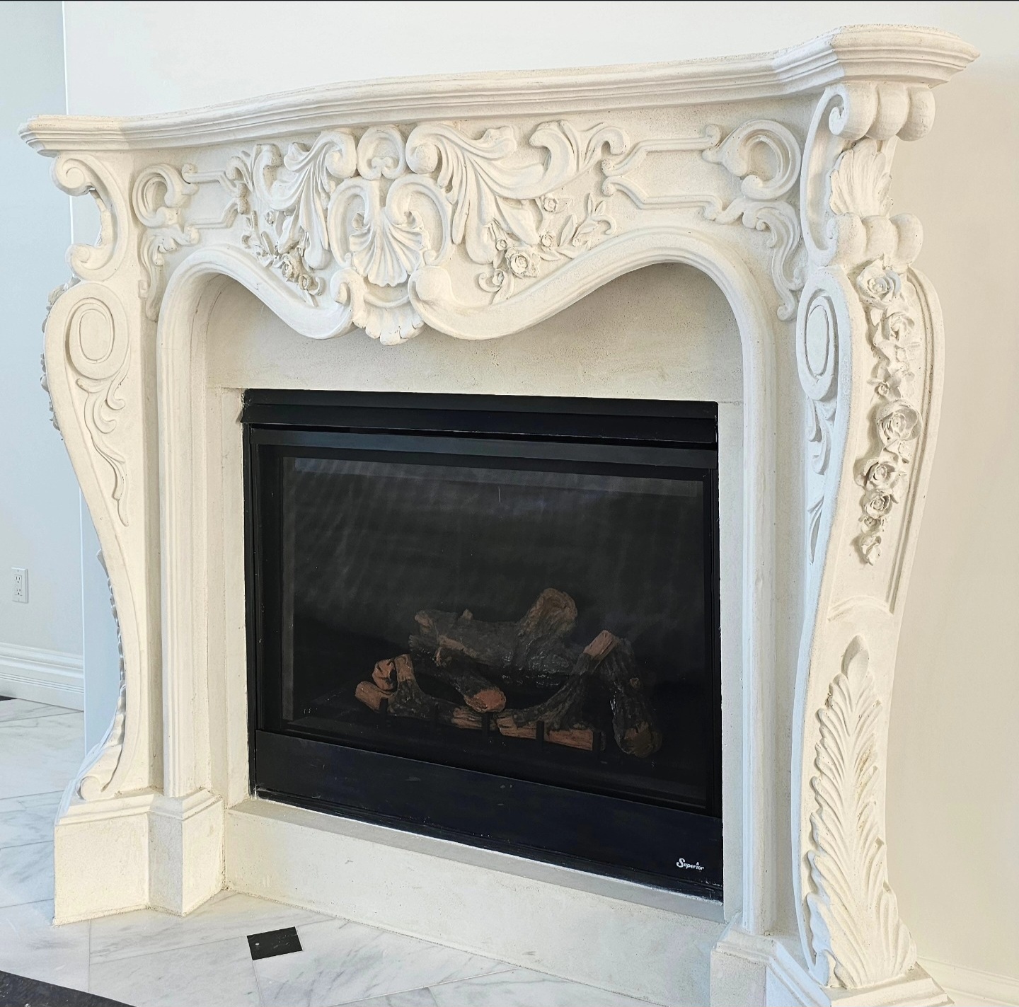 Custom ornate architectural precast fireplace mantel with decorative carvings installed by Lions Precast in Fresno California