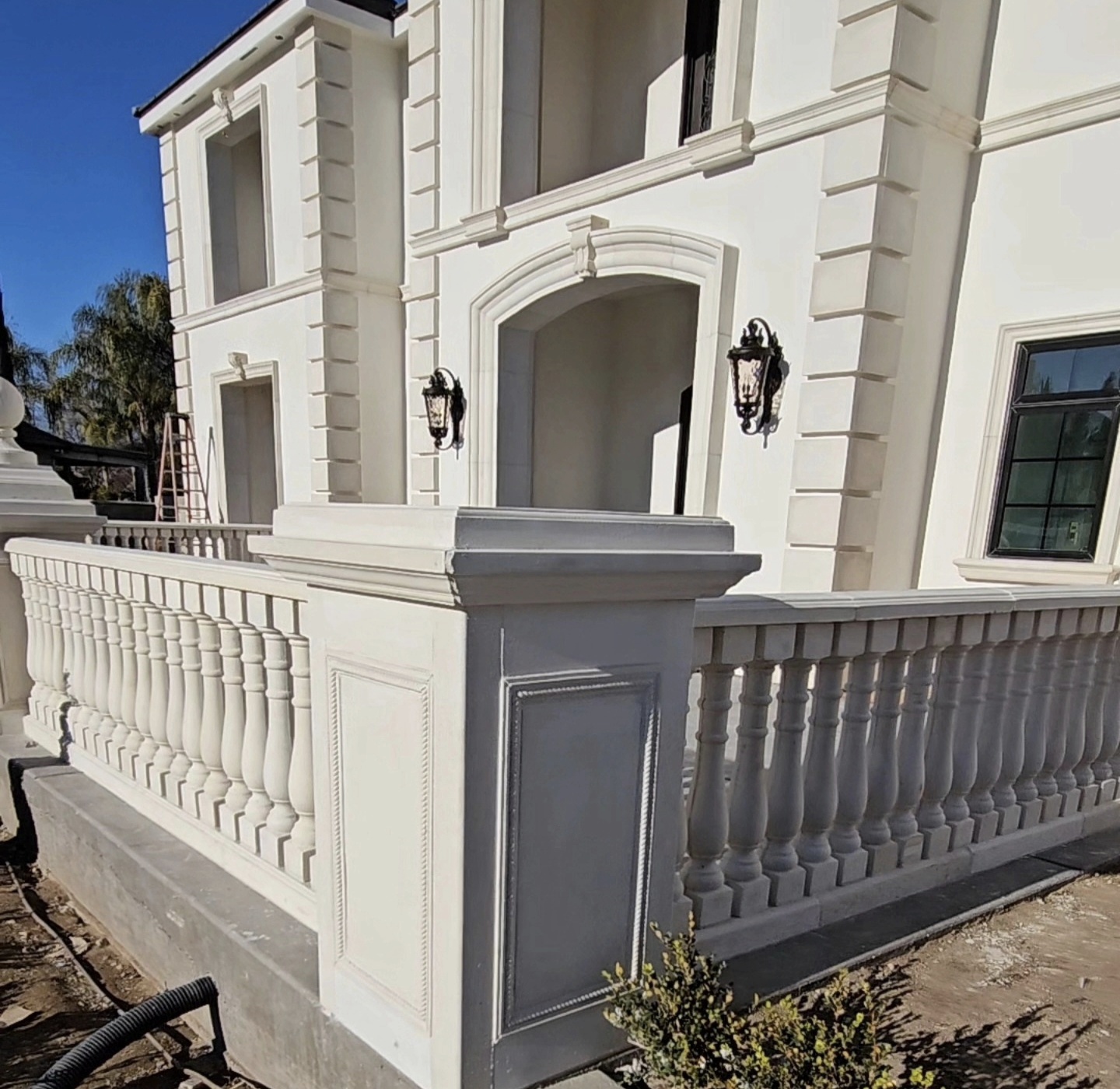 Custom architectural precast balustrade railing system installed by Lions Precast on luxury home exterior in Fresno California