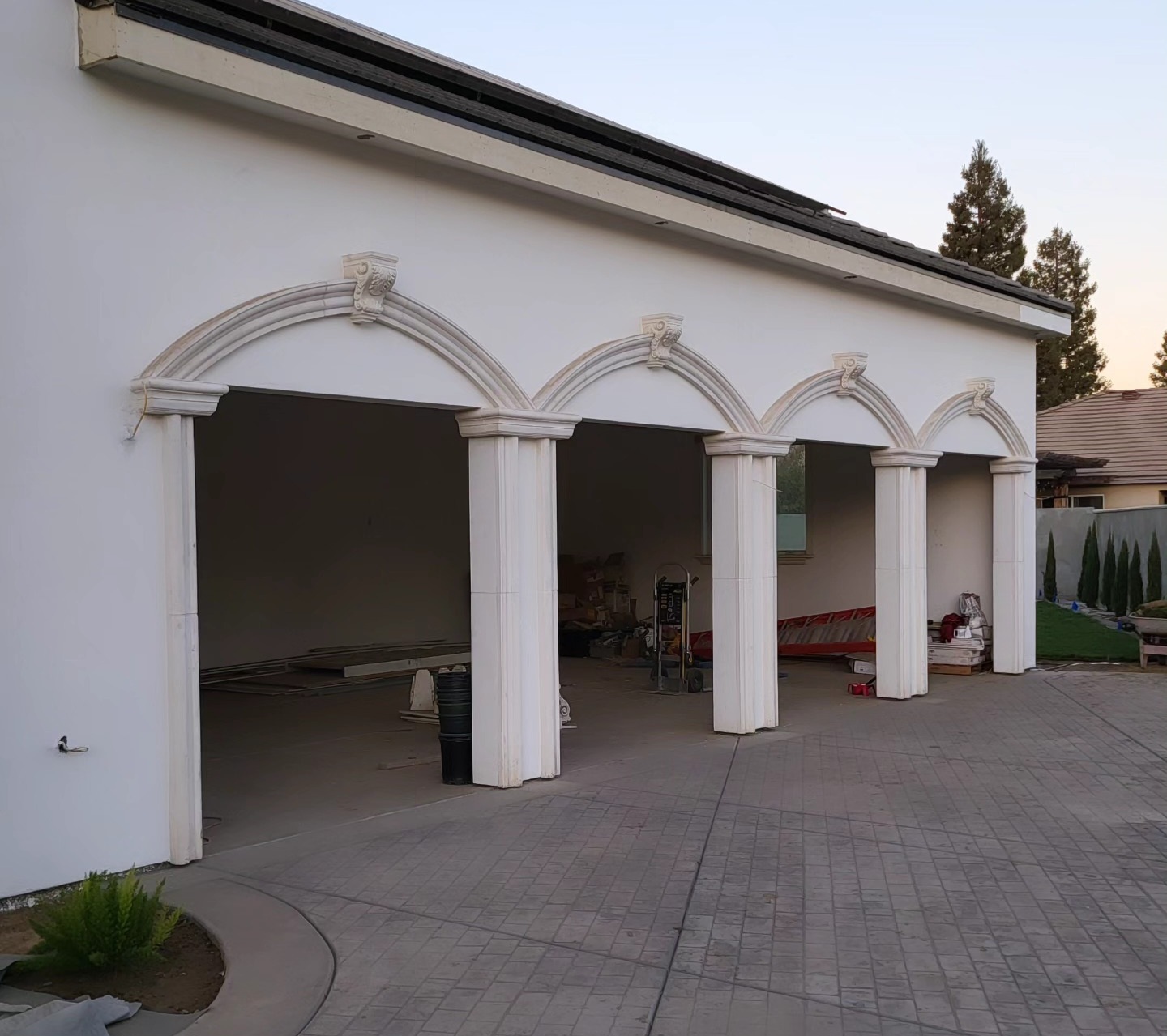 Architectural precast columns and arched garage openings installed by Lions Precast on luxury home in Fresno California