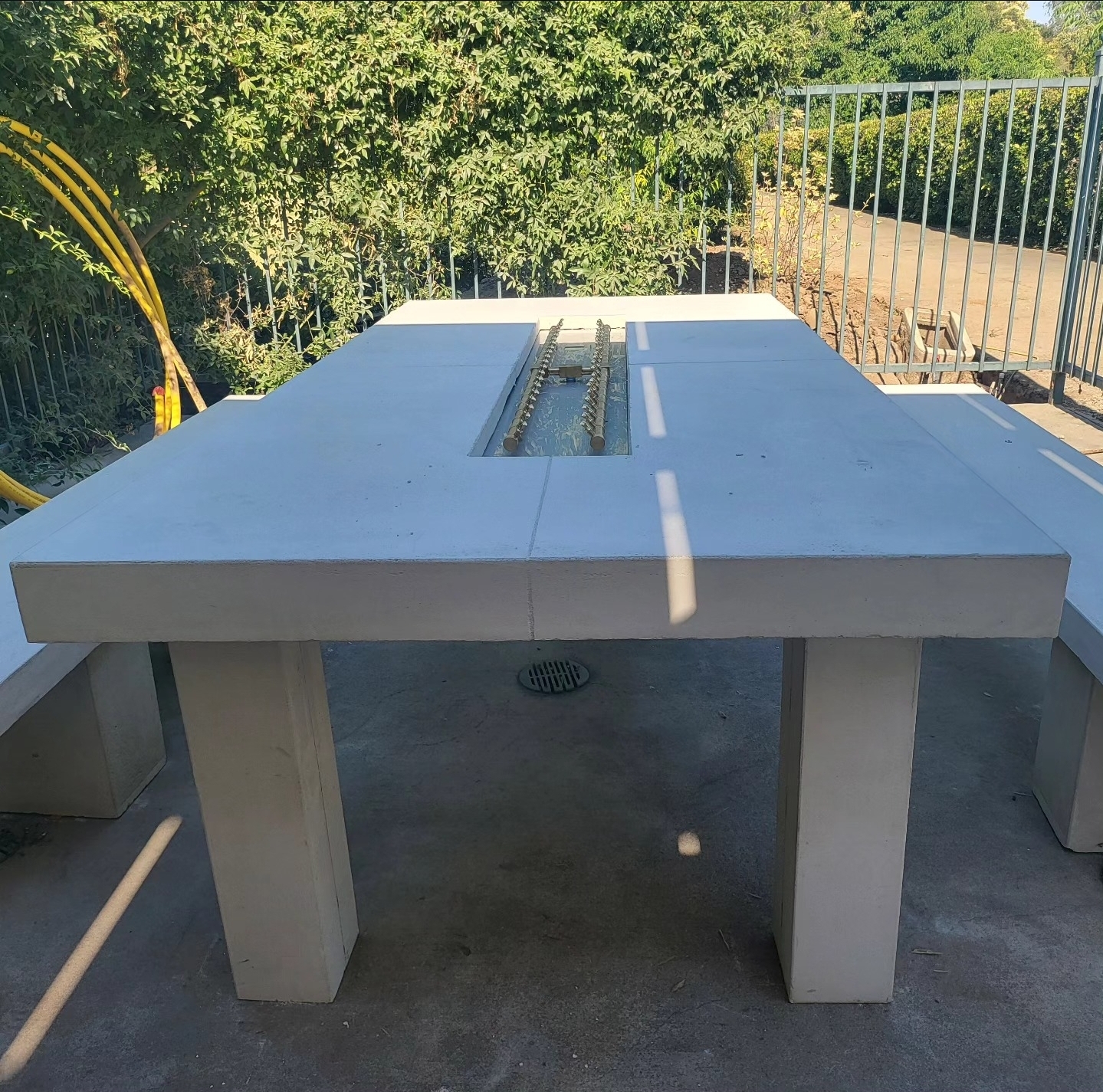 Custom architectural concrete outdoor fire table installed by Lions Precast in Fresno California
