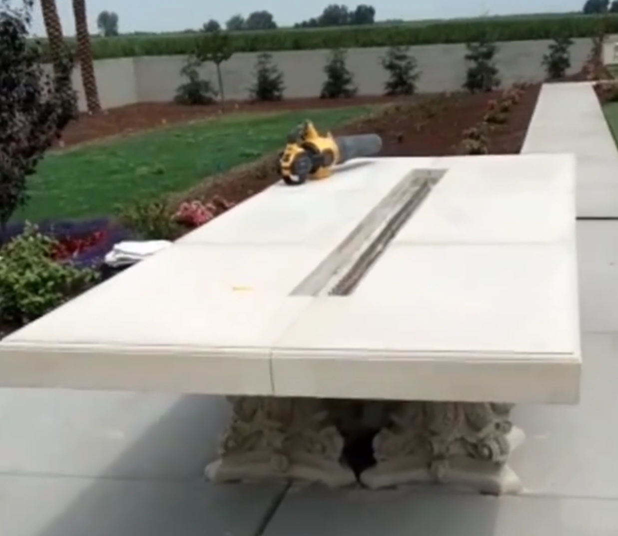 Custom architectural concrete outdoor fire table with decorative precast column bases installed by Lions Precast in Fresno California